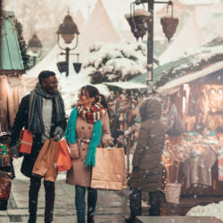 shopping in the holiday market while it snows