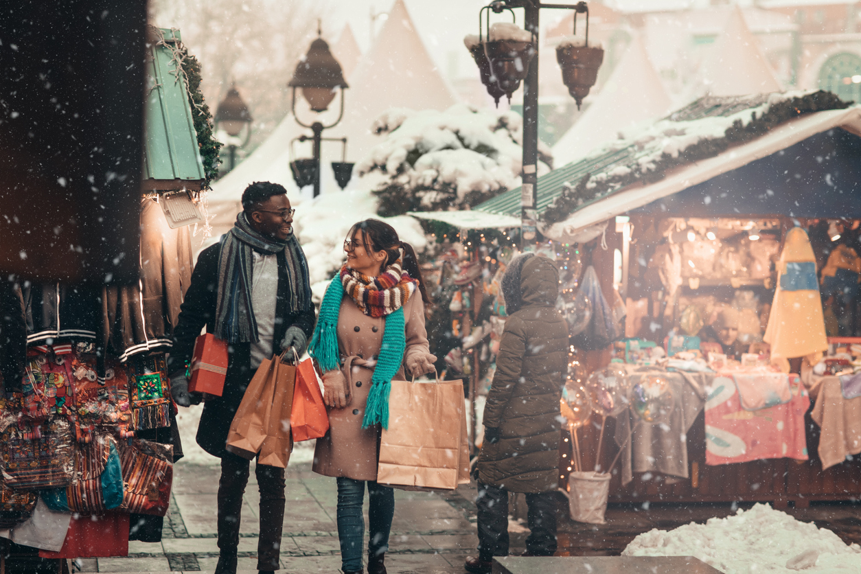 shopping in the holiday market while it snows