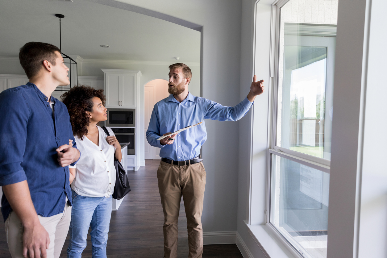 Couple working with a property management team to help landlords and investors feel at ease and tenants feel right at home.